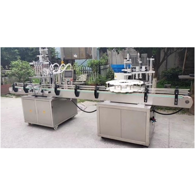 Máy chiết rót và xoáy nắp chai